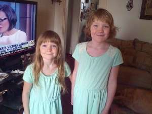 Emma and Abby in green dresses